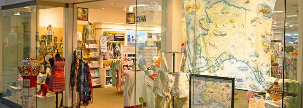 Xplorer Maps products in a store front in Alaska.
