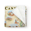 Arches & Canyonlands National Park Fleece Blanket in earth tones. It features Island in the Sky, Panorama Point Overlook, Angel Arch, Chester Park, Peteās Mesa, Colorado and Green River, Park Avenue, Double Arch, Balanced Rock, Tower Arch, Double O Arch, and Delicate Arch. Wildlife and plants include rattlesnakes, bobcats, Desert Bighorn sheep, falcons, golden eagles, red foxes, porcupines, mule deer, mountain lions, coyotes, and lizards. Indian Paintbrush, Claret Cup Cacti, and Columbines.