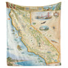 Hanging California State Map Fleece Blanket in earth-tones. It features major cities of Sacramento, San Francisco, Los Angeles, San Diego, Hollywood, and more. Aquatic life such as whales, sea turtles, and an abundance of fish species. National Parks and attractions are also illustrated such as Yosemite, Sequoia Disneyland, Redwood Forest, Golden Gate Bridge and Death Valley.