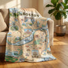 Boston-themed blanket draped over a couch in a living room setting