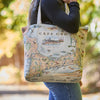 Person holding a tote bag with a map design of Cape Cod.