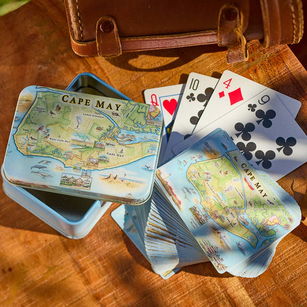 Playing cards with Cape May map design on a wooden surface