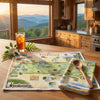 Kitchen scene with a scenic view, a glass of iced tea, and a map of Tennessee.