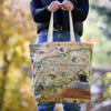 Tote bag with Great Smoky Mountains National Park design held by a person outdoors.