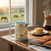 Mug with Kentucky map design on a wooden table with a plate of biscuits and a Chemex coffee maker.
