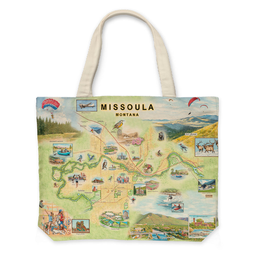 Canvas tote bag featuring a hand-drawn map of Missoula, Montana, by artist Chris Robitaille. The design highlights local landmarks, rivers, and mountain ranges in a vintage-style illustration. Tote shown with sturdy handles and spacious interior.