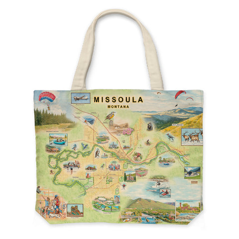 Canvas tote bag featuring a hand-drawn map of Missoula, Montana, by artist Chris Robitaille. The design highlights local landmarks, rivers, and mountain ranges in a vintage-style illustration. Tote shown with sturdy handles and spacious interior.