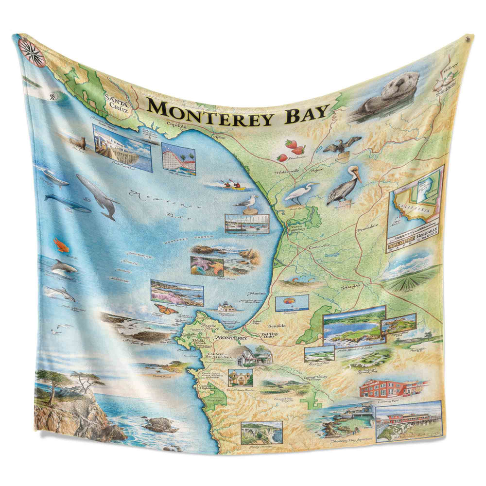 Monterey map blanket hanging to display full hand-drawn map of Monterey Bay. Made from 50% Berber fleece and 50% microfiber fleece for warmth.