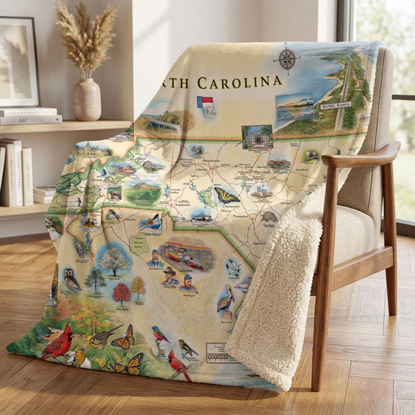 Blanket with North Carolina map design draped over a chair in a room.