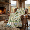 Blanket with Pennsylvania map design draped over a leather chair in a cozy room with a fireplace and windows.