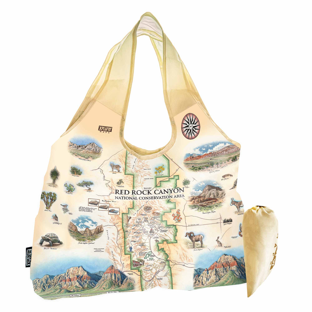 Red Rock Canyon National Conservation Area Map Pouch Tote Bags by Xplorer Maps. The map features illustrations of places such as Mt. Willson, Rainbow Mountain, Bridge Mountain, and Spring Mountain Ranch. Flora and fauna include a red tail hawk, desert Bighorn, Globemallow, Joshua tree, and Prickly pear cactus.