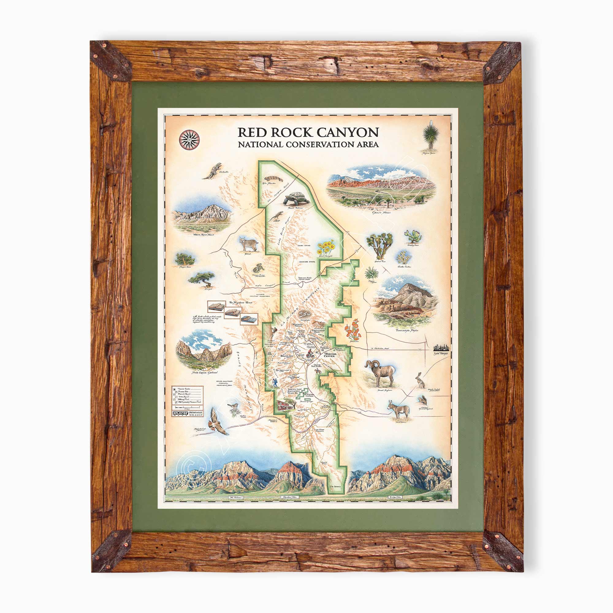 A framed vintage-style map of Red Rock Canyon National Conservation Area, featuring an illustrated map with scenic details, surrounded by a green mat and a rustic brown wooden frame.