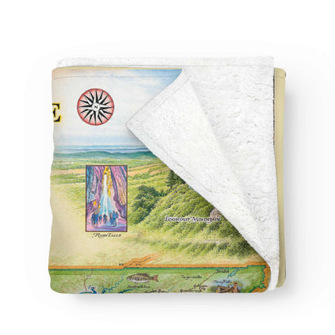 Folded Tennessee Map Fleece Blanket with a corner turned back, revealing soft fleece lining and hand-drawn state map design.