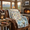 Cozy living room with a fireplace, map blanket, and mountain view