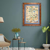 Framed Utah State Map hanging on a greenish teal wall above a plant and chair in a living room. 