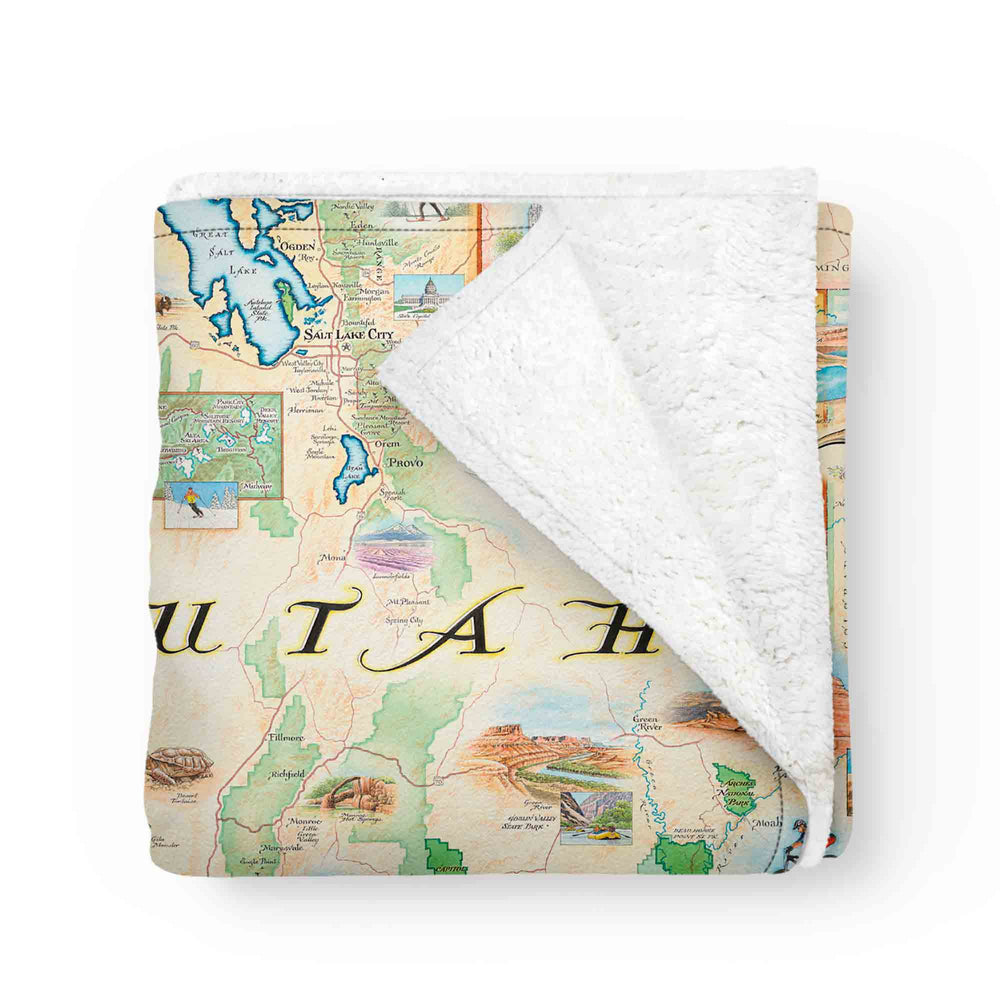  Utah State Map fleece blanket. Featuring intricate details of popular cities, iconic landmarks such as Arches National Park and Bryce Canyon, and vibrant flora and fauna indigenous to the region.
