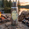 Stainless steel thermos with a Wisconsin map label on a camping scene with a lake and fire.