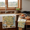 Kitchen with a sink, countertop, and towels featuring a map design.
