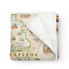 Utah's Capitol Reef National Park Map fleece blanket in earth tones. Featuring Claret Cup Cactus, Narrowleaf Yucca, Prince's Plume, and the Two-Needle Pinyon Pine. Detailed depictions of landmarks and geographic wonders like the Lower Muley Twist Canyon, Capitol Gorge, and Hickman Natural Bridge. Measures 58"x50."