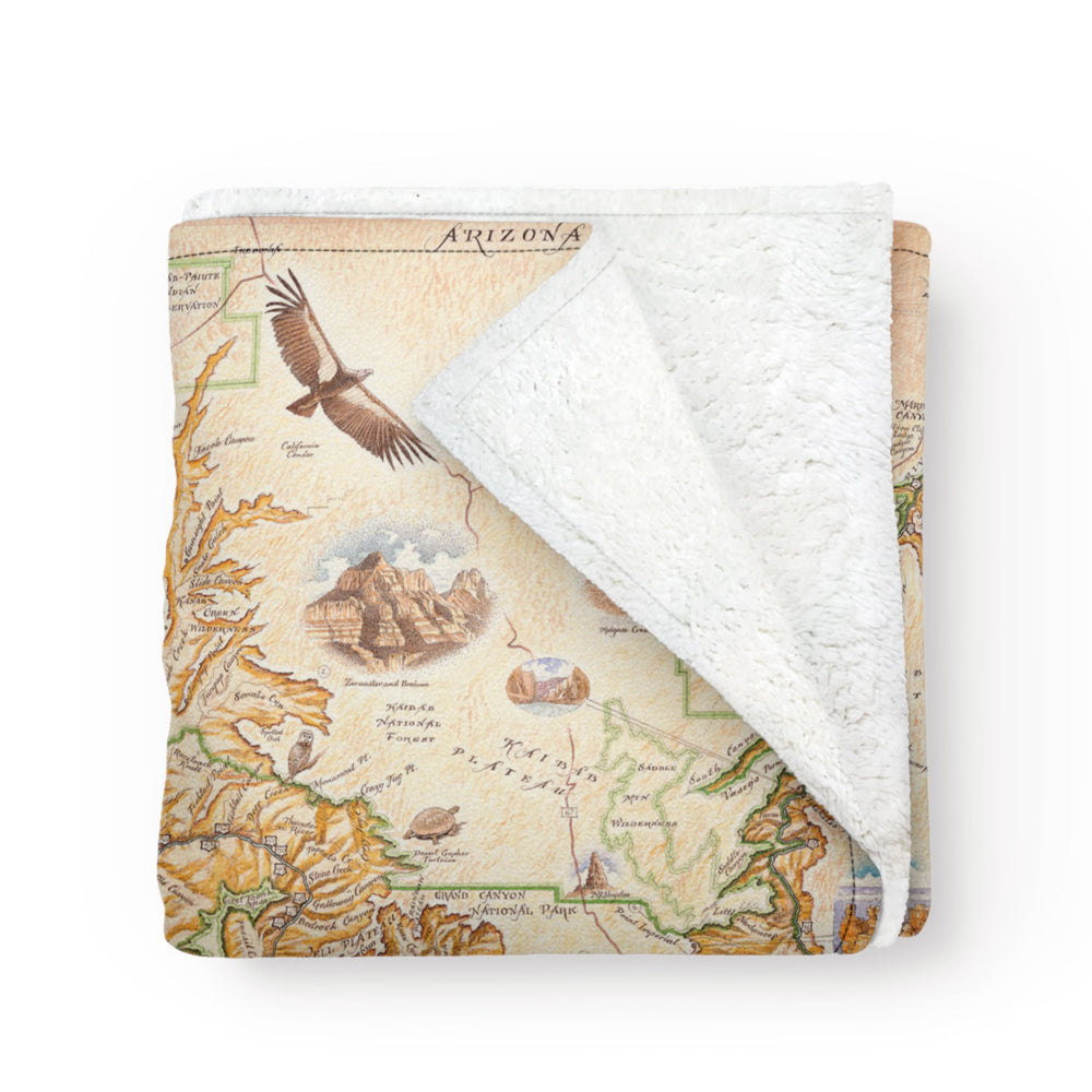 Folded blanket with map of the Grand Canyon. Stunning artwork.