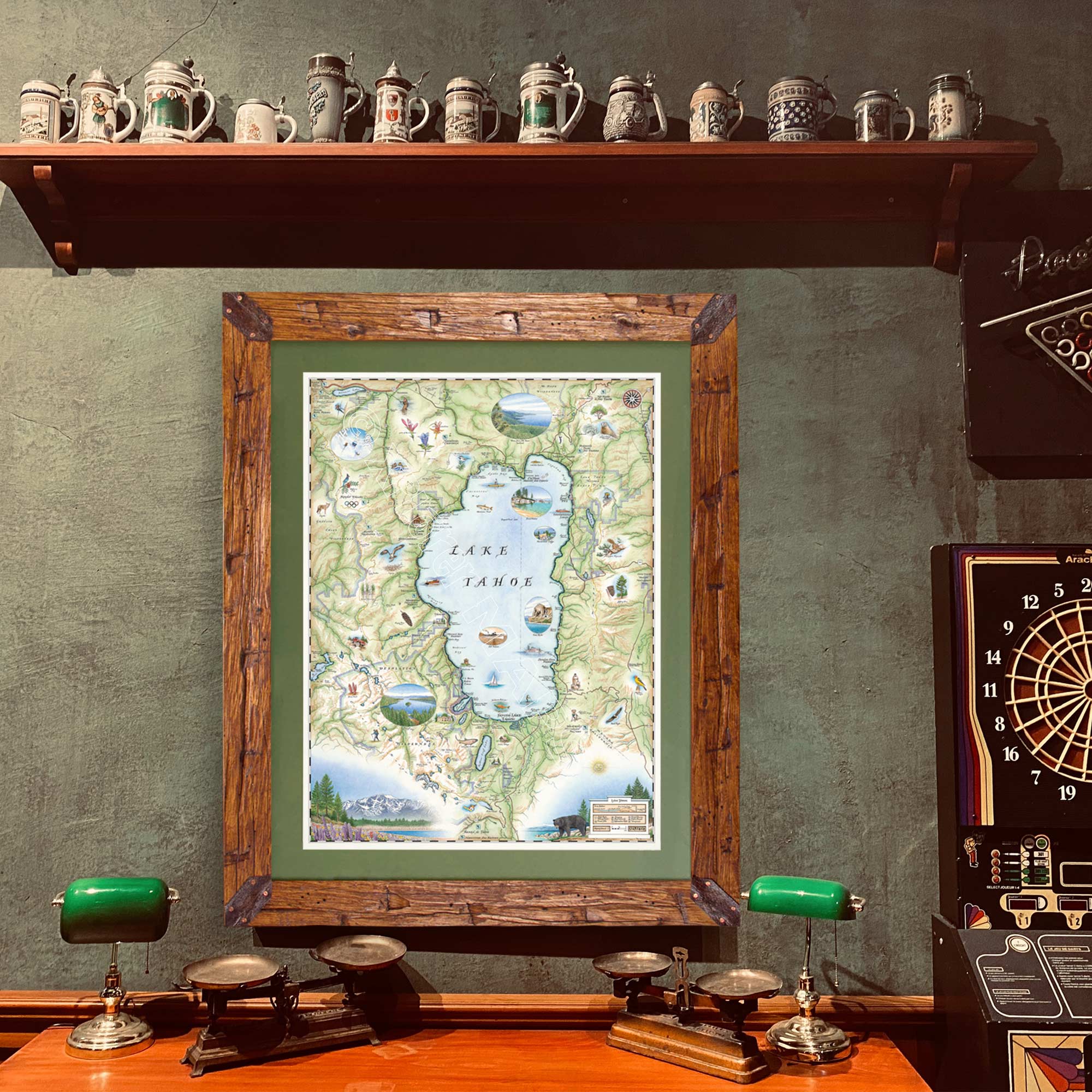 Xplorer Maps' Lake Tahoe hand-drawn map hanging on a green wall in a game room below a shelf of beer steins.