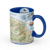 Blue 16 oz Santa Catalina Island Map Ceramic Mug. The map features illustrations of places such as Wrigley Memorial, El Rancho Escondido, and Avalon Bay. Flora and fauna include Bison, Catalina Island Fox, Catalina Orange Lip butterfly, Channel Islands tree poppy, and Island oak. 